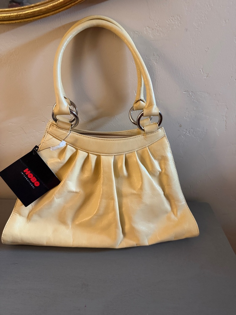 HOBO Soft Pleated Shoulder Bag in Pale Yellow Leather